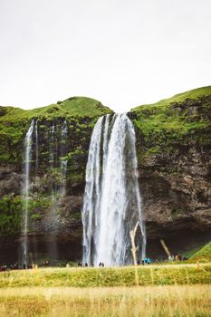 Gljufrafoss, or Gljufrabui, waterfall, a small waterfall hidden on a narrow canyon near the more famous Seljalandsfoss, southern Iceland. High quality photo.