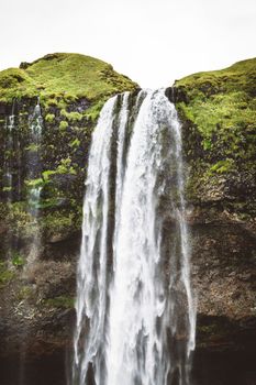 Vertical photo perfect view of famous powerful Gljufrabui cascade in sunlight. Dramatic and gorgeous scene. Unique place on earth. Location place Iceland, sightseeing Europe. Explore the world's beauty and wildlife. High quality photo