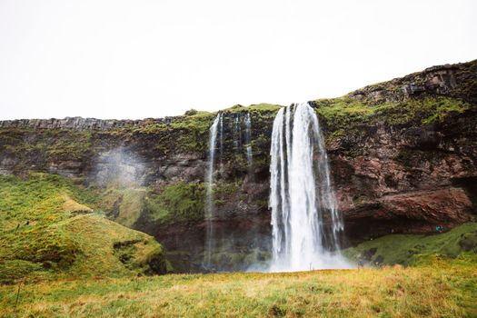 Gljufrafoss, or Gljufrabui, waterfall, a small waterfall hidden on a narrow canyon near the more famous Seljalandsfoss, southern Iceland. High quality photo.