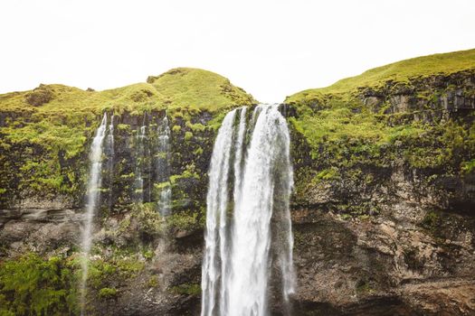 Gljufrafoss, or Gljufrabui, waterfall, a small waterfall hidden on a narrow canyon near the more famous Seljalandsfoss, southern Iceland. High quality photo.