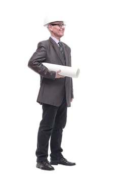 in full growth. business man in a protective helmet with drawings. isolated on a white background.