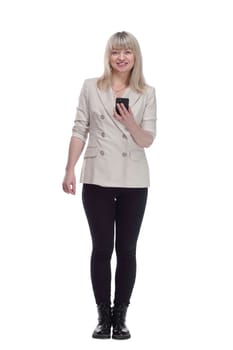 in full growth. attractive woman reading message on her smartphone . isolated on a white background.