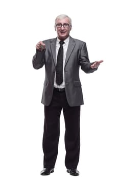 in full growth. business man with keys in hand. isolated on a white background.