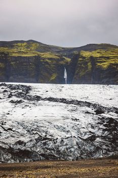 Fantastic view on Solheimajokull glacier in Katla Geopark on Icelandic Atlantic South Coast. Location: South glacial tongue of Myrdalsjokull ice cap, near Vik village, Iceland, Europe. High quality photo