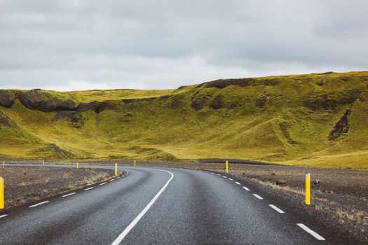 Road and mountain view during road trip in iceland. Foggy landscape in autumn time. High quality photo