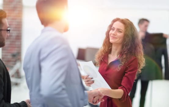 handshake between the designer and the client.concept of partnership