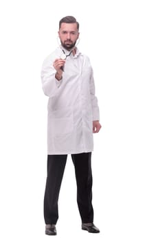 in full growth. confident doctor therapist with a stethoscope . isolated on white