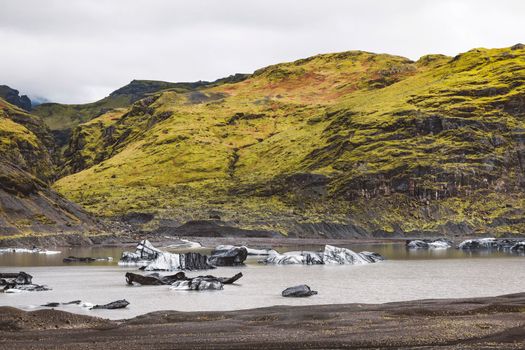 Hiking in the incredible jurassic wild landscape of green mountains, among glaciers and volcanoes. High quality photo