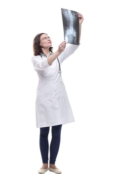 Mature female doctor looking at an x-ray. isolated on a white background.