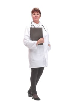 Side view portrait of senior female doctor on white background holding clipboard looking at camera smiling