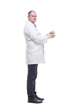 in full growth. researcher with a laboratory flask in his hands. isolated on a white background.