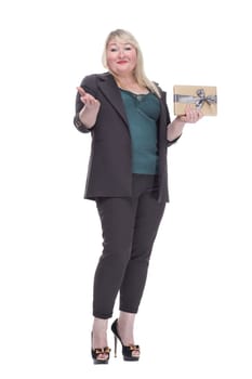 in full growth. attractive mature woman with gift box. isolated on a white background.