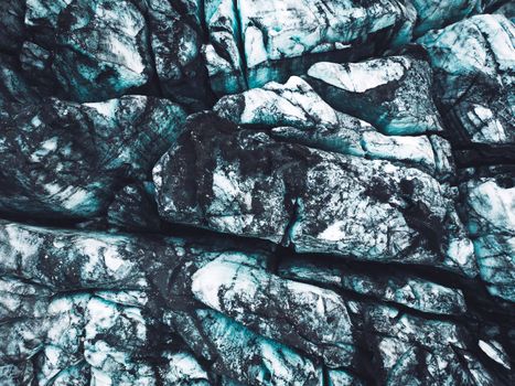 Top down close up view, dirt across the ice formation on a glacier in Iceland. Autumn time.