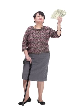 full-length. casual elderly woman with a fan of banknotes. isolated on a white background.