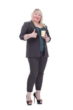 in full growth. tired adult woman with takeaway coffee looking at the camera . isolated on a white background.
