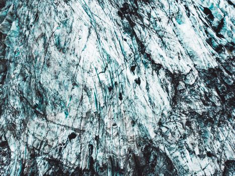 Top down close up view, dirt across the ice formation on a glacier in Iceland. Autumn time.