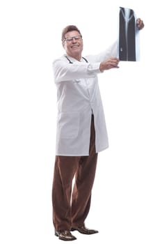 side view . a male doctor looking at an x- ray of a patient. isolated on a white background