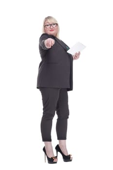 side view. attractive mature woman using a digital tablet . isolated on a white background.