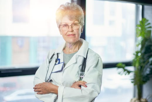 Friendly mature female doctor at hospital smiling