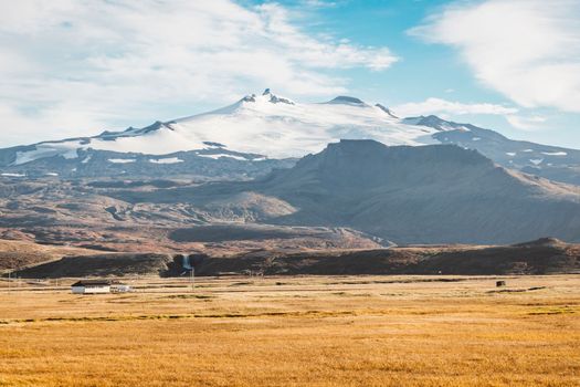 Snowy Snaefellsjokull volcano summit. Iceland volcano landscape in autumn with white glacier cap. Hiking in Saefellsnes peninsula in western Iceland. High quality photo