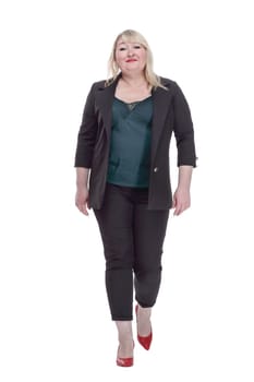 in full growth. smiling woman in a summer pantsuit striding forward. isolated on a white background.