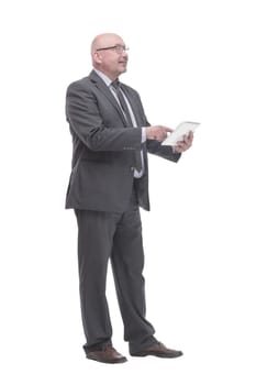 in full growth. business man with a digital tablet.isolated on a white background.