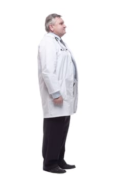 in full growth. competent doctor in a white coat. isolated on a white background.