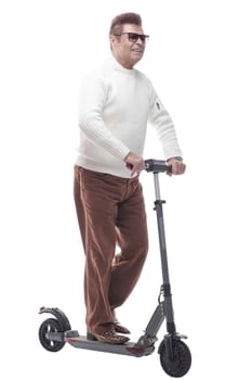 in full growth. casual adult male with electric scooter. isolated on a white