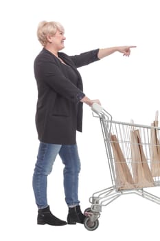 full-length. casual mature woman with shopping cart . isolated on a white background.