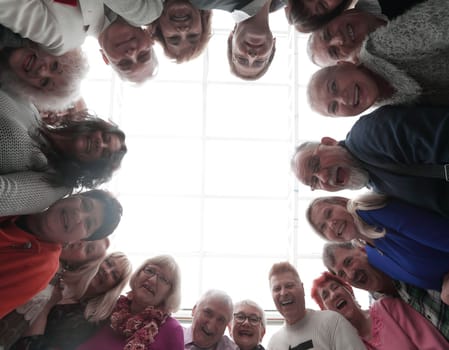 Happy people looking down at camera stay in sircle