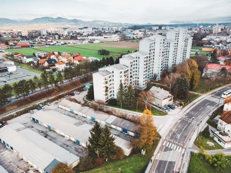 Aerial view, drone shoot, residential buildings on the outskirts of the city of Celje in Slovenia, some older and newer looking residential buildings.