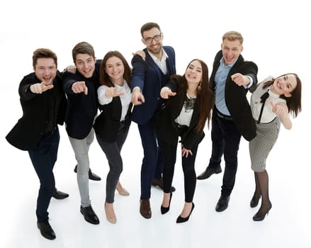 in full growth. group of young business people pointing at you . isolated on a white background.