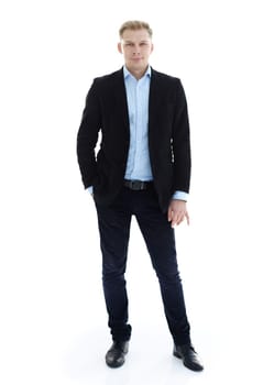 in full growth.a young man in a stylish business suit. isolated on a white background.