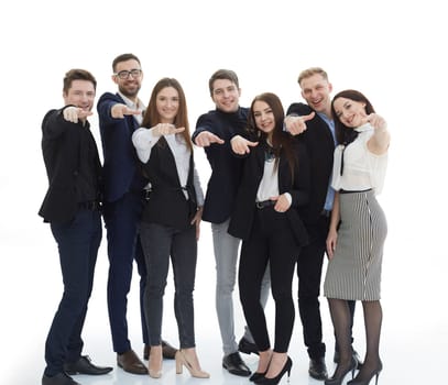 in full growth. group of young business people pointing at you . isolated on a white background.