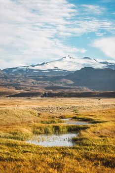 Snowy Snaefellsjokull volcano summit. Iceland volcano landscape in autumn with white glacier cap. Hiking in Saefellsnes peninsula in western Iceland. High quality photo
