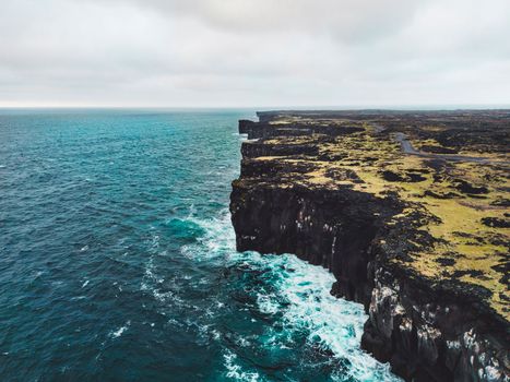 View of the sea in West Iceland highlands, Snaefellsnes peninsula, View Point near Svortuloft Lighthouse. Spectacular black volcanic rocky ocean coast with cave arch and towers. High quality photo