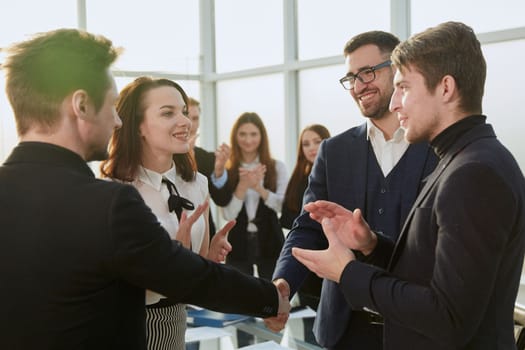 smiling business partners shaking hands with each other. concept of cooperation.