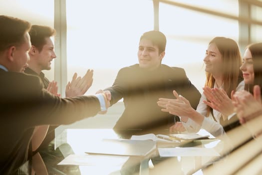 business partners shaking hands during negotiations in the office. photo with a copy-space.