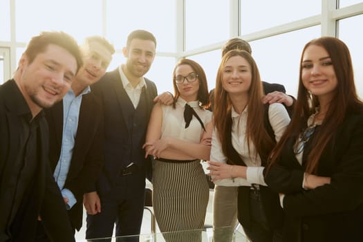team of young professionals standing in the office. concept of teamwork.