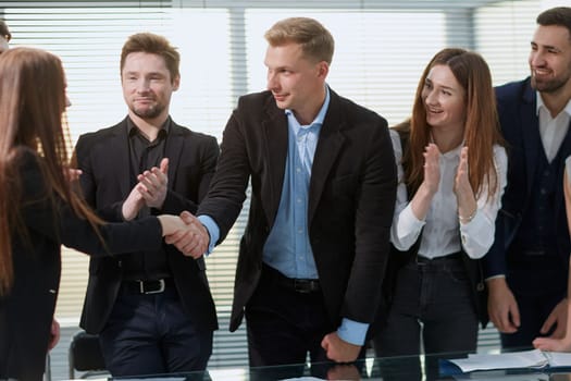 group of employees enthusiastically discussing business documents . business concept .