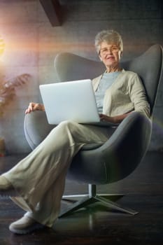 woman sitting in a chair in Art Nouveau style. Business, elegant businesswoman working on laptop . Interior, furniture.
