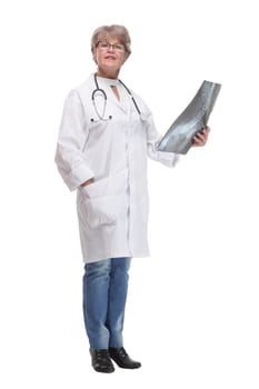 Front view of female doctor wearing stethoscope and glasses looking at an x-ray. Concept of medical help