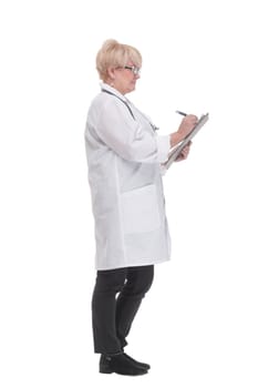 in full growth. competent doctor with a clipboard. isolated on a white background.
