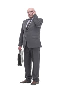 Executive business man with a leather briefcase. isolated on a white background.