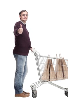 full-length. casual man with shopping cart. isolated on a white background.