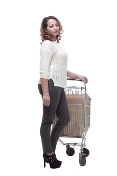 full-length. casual young woman with shopping cart. isolated on a white background.