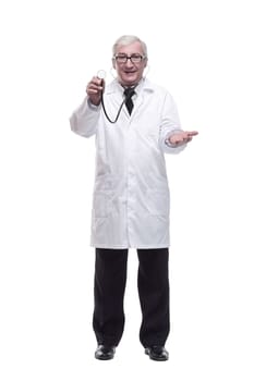 in full growth.friendly mature doctor with a stethoscope in hand. isolated on a white background.