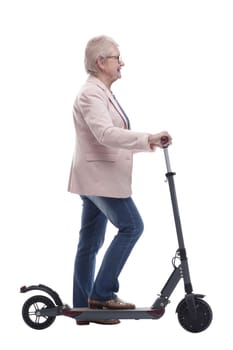 side view. modern elderly woman with electric scooter. isolated on a white background