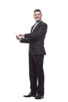 in full growth. happy young businessman with a digital tablet . isolated on a white background.