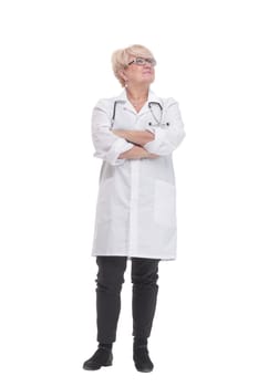 in full growth. competent doctor in a white coat. isolated on a white background.